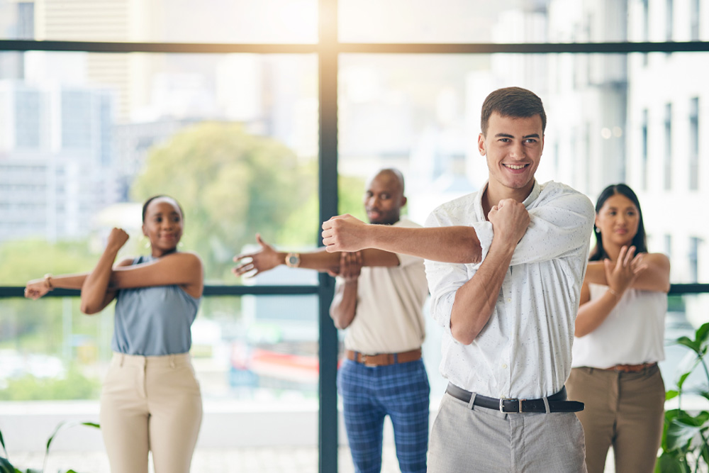 Workplace wellness, stretching. Oak Enrichment Concierge Wellness.